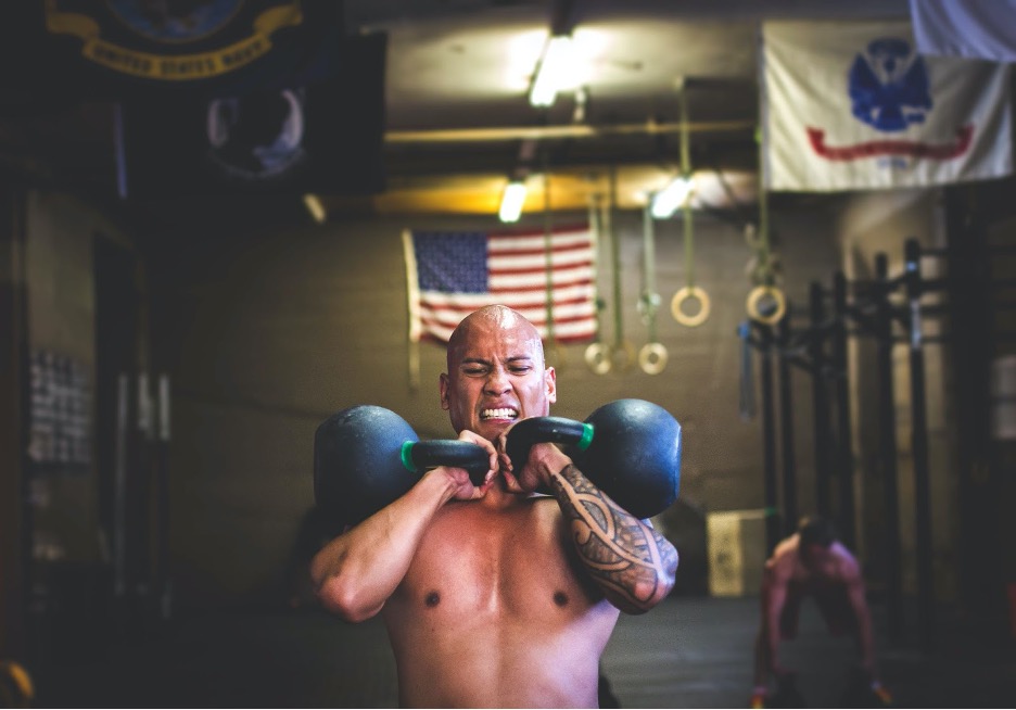 Man training with kettlebells