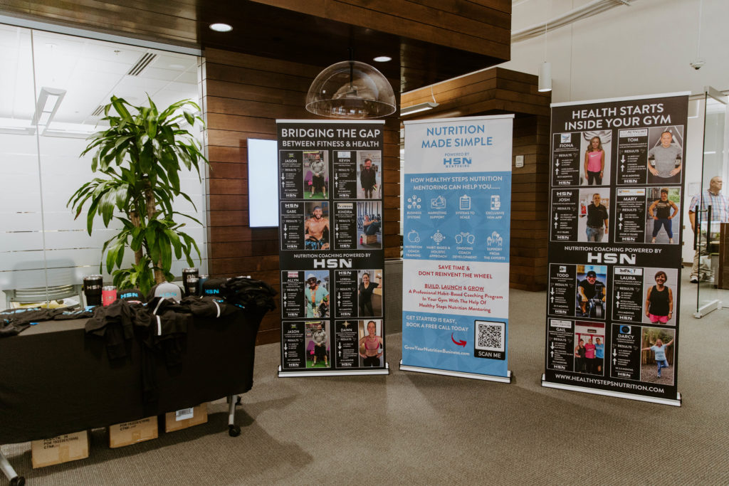 HSN Mentoring table and posters about running a nutrition program at your gym