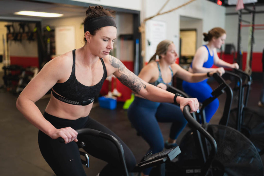 Athletes using air bikes during The Gains Lab program